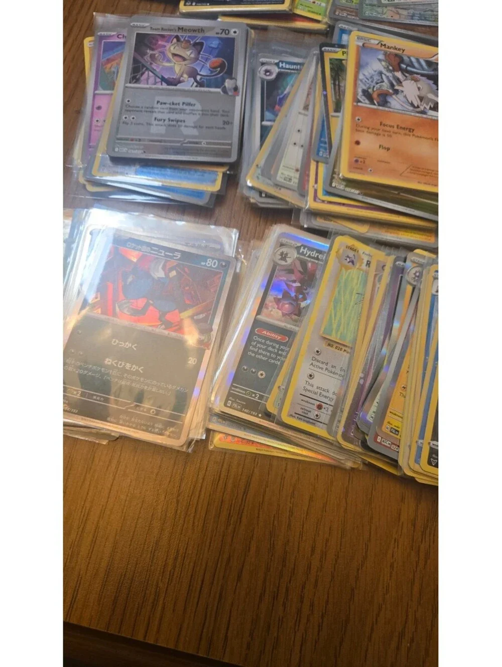 Bulk Lot of Mixed Pokemon Trading Cards with Sleeves and Storage Box